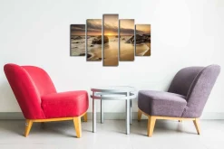 Lerretsbilde i 5 deler 82x50 cm - Solnedgang over en strand med steiner og rolige bølger
